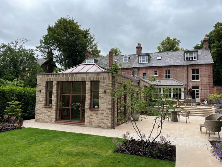 A single storey rear extension to create home offices and single storey extension to create a garage in Norwich.